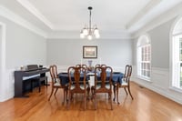 Formal Dining Room off Foyer. Custom blinds though out the home.